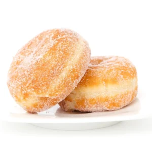 Two sugar donuts on a plate with one sitting up