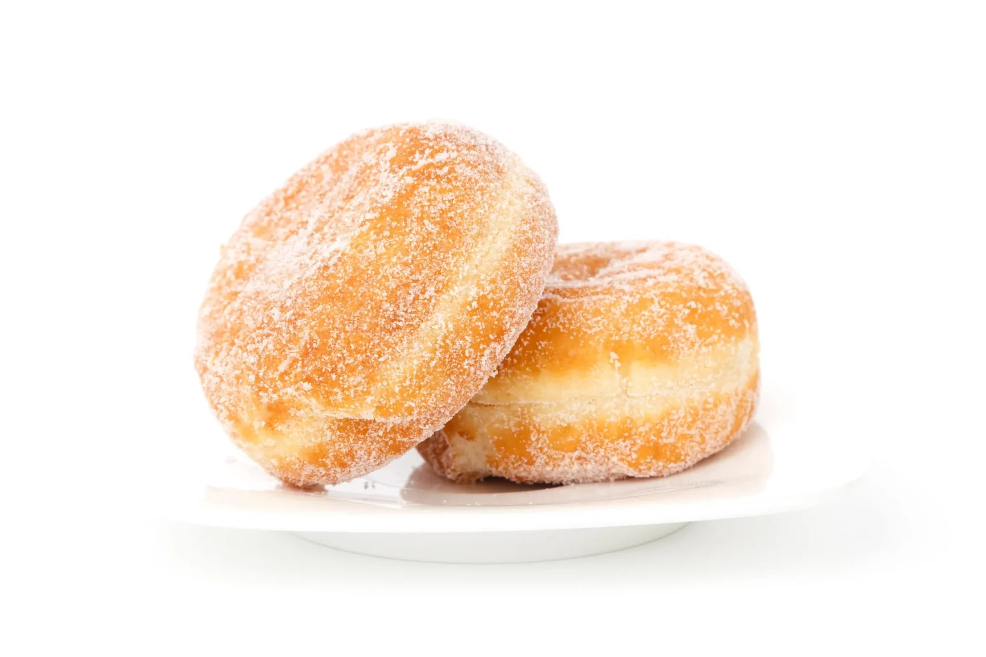 Two sugar donuts on a plate with one sitting up